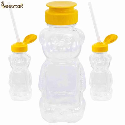 購入 卸し売り良質300g蜂蜜の瓶およびスプーンのプラスチック空の蜂蜜くまびん オンライン製造