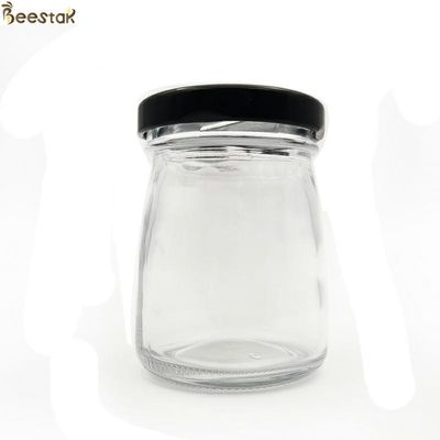 購入 50ml 75mlの蜂蜜の瓶は小型蜂蜜の瓶をスプーンでつぐために空け、 オンライン製造