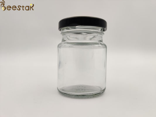 購入 ガラス蜂蜜のるつぼガラスの容器のあたりの50ml 75mlの鳥の巣のびんは黒いふたによってびん詰めにする オンライン製造